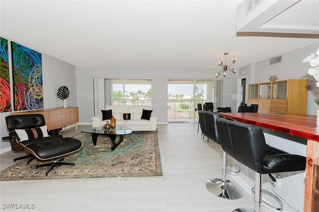 living room featuring an inviting chandelier