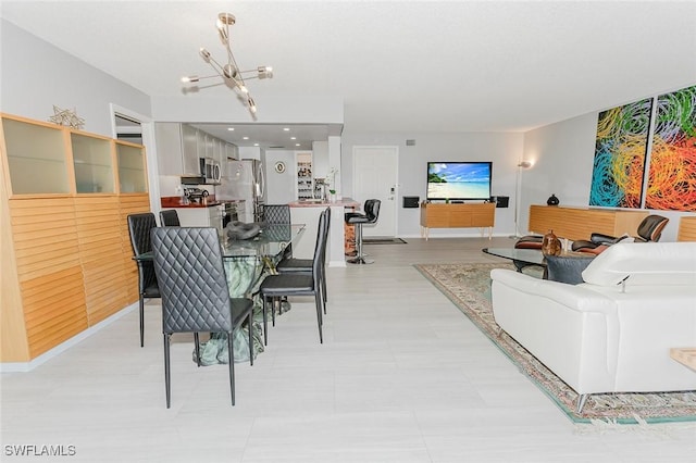 2600 Gulf Shore Blvd N Unit 32, Naples, FL 34103 - dining space with a chandelier and baseboards