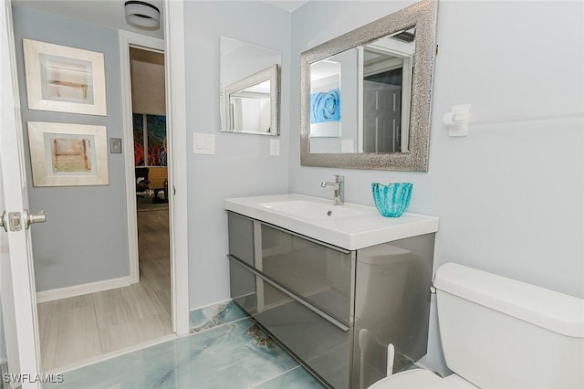 2600 Gulf Shore Blvd N Unit 32, Naples, FL 34103 - bathroom featuring toilet and vanity