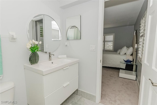 2600 Gulf Shore Blvd N Unit 32, Naples, FL 34103 - ensuite bathroom with vanity and toilet