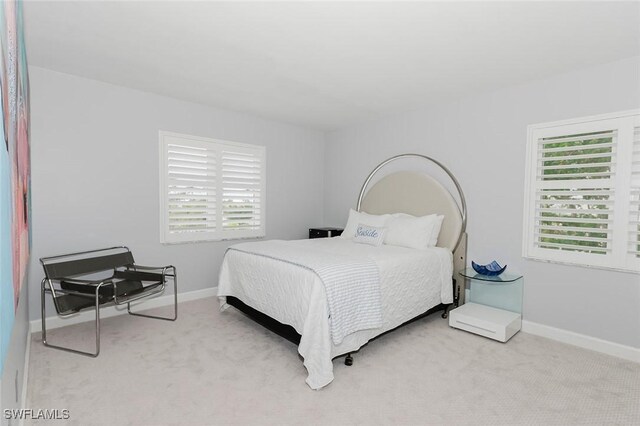 2600 Gulf Shore Blvd N Unit 32, Naples, FL 34103 - bedroom with carpet floors and baseboards