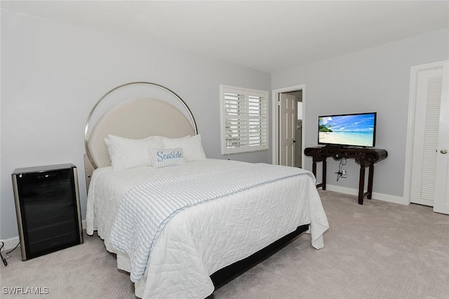 bedroom featuring light colored carpet