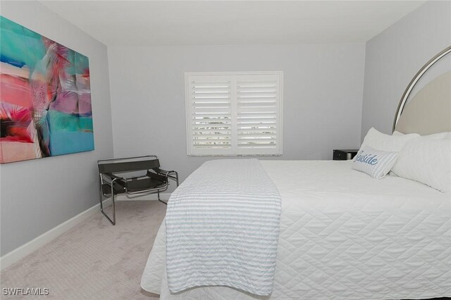 2600 Gulf Shore Blvd N Unit 32, Naples, FL 34103 - carpeted bedroom featuring baseboards
