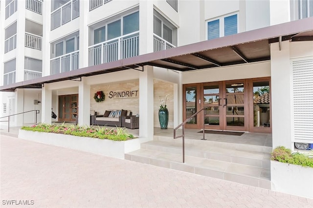 property entrance featuring french doors and an outdoor hangout area