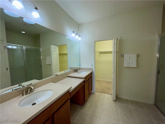 bathroom featuring vanity and an enclosed shower