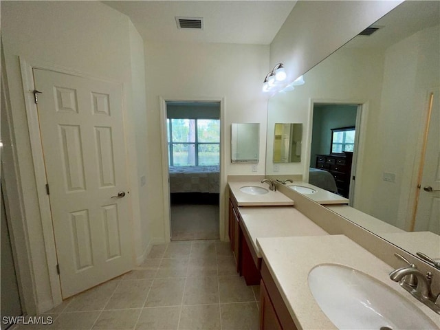 bathroom with tile patterned flooring and vanity