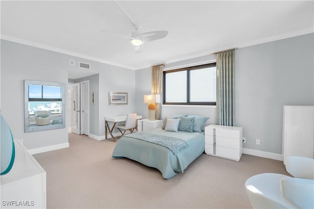 carpeted bedroom with crown molding and ceiling fan