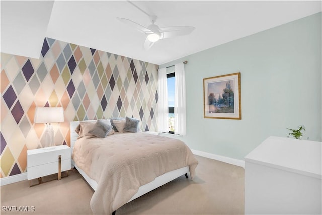 bedroom featuring light colored carpet and ceiling fan