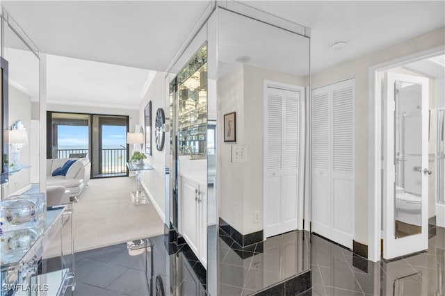 bathroom featuring crown molding and tile patterned floors