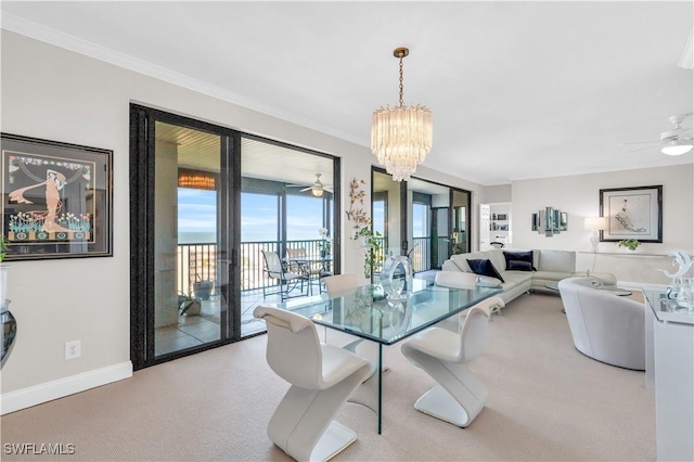 dining space featuring crown molding and ceiling fan with notable chandelier