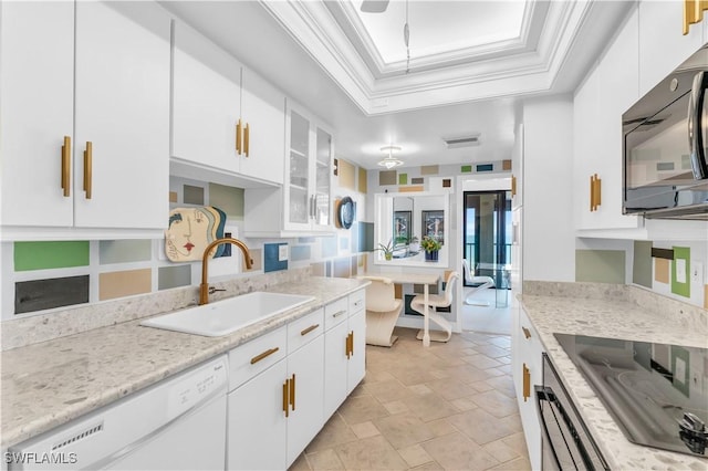 kitchen featuring white cabinetry, light stone countertops, sink, and black appliances