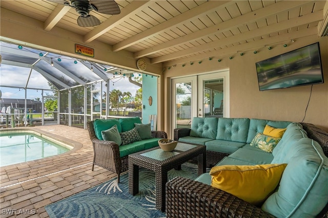 sunroom / solarium featuring beam ceiling, ceiling fan, and a swimming pool