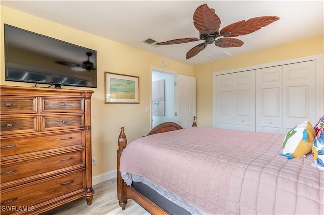 bedroom featuring a closet, ceiling fan, and light hardwood / wood-style floors