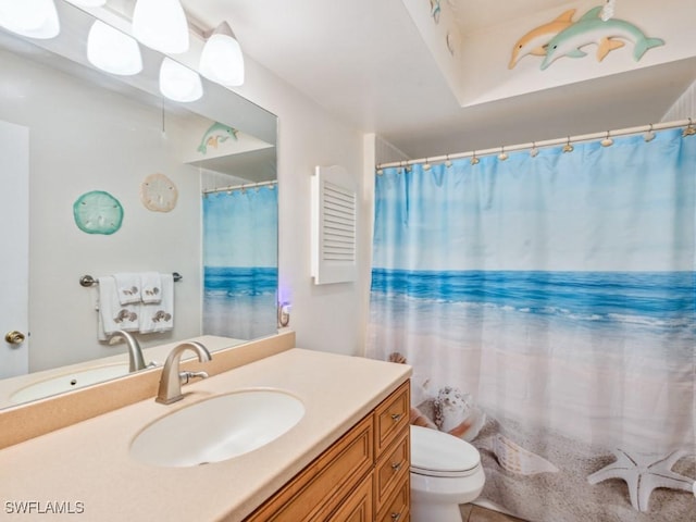 bathroom featuring vanity and toilet