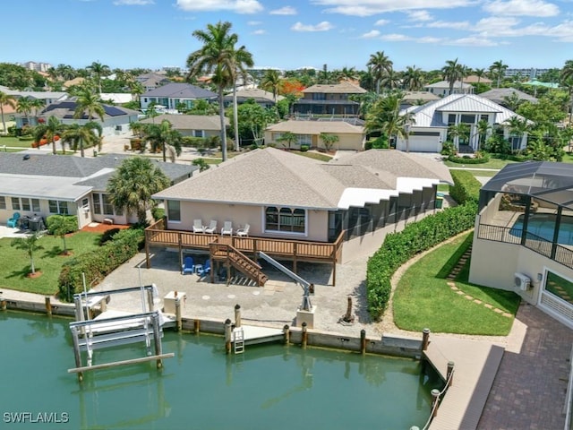 851 Perrine Ct, Marco Island, FL 34145 - back of house featuring boat lift, a residential view, a deck with water view, stairs, and a lanai