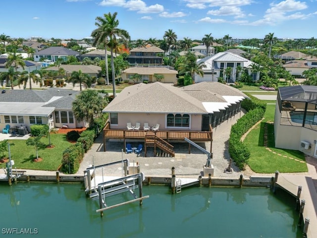 851 Perrine Ct, Marco Island, FL 34145 - back of property featuring boat lift, a residential view, a yard, stairs, and a deck with water view
