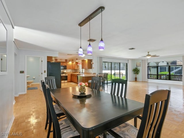 851 Perrine Ct, Marco Island, FL 34145 - dining space featuring a ceiling fan and baseboards