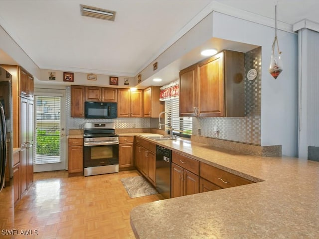 851 Perrine Ct, Marco Island, FL 34145 - kitchen featuring black appliances, healthy amount of natural light, and backsplash