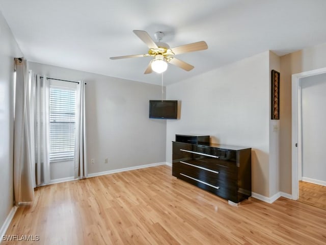 851 Perrine Ct, Marco Island, FL 34145 - unfurnished room with light wood-style flooring and a ceiling fan