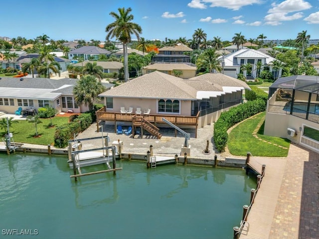 851 Perrine Ct, Marco Island, FL 34145 - dock area with a residential view, stairway, a deck with water view, and a lawn