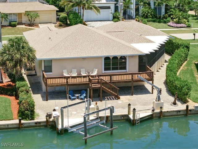 851 Perrine Ct, Marco Island, FL 34145 - rear view of house with roof with shingles, boat lift, a deck, stairway, and stucco siding