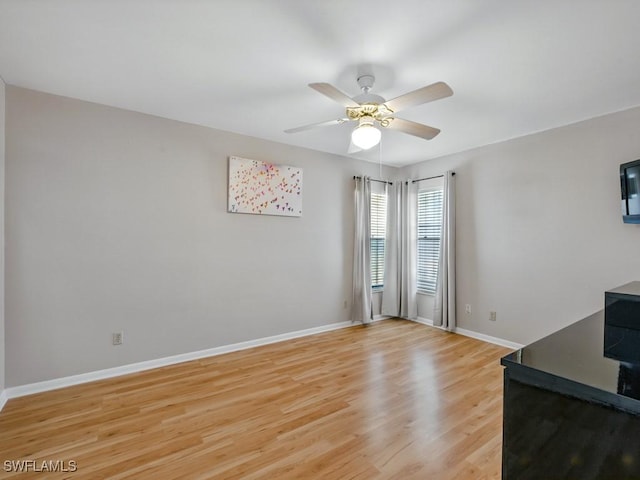 851 Perrine Ct, Marco Island, FL 34145 - unfurnished living room featuring light wood-type flooring and a ceiling fan