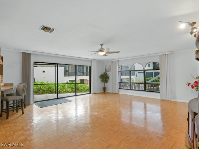851 Perrine Ct, Marco Island, FL 34145 - living room with a ceiling fan, healthy amount of natural light, and crown molding