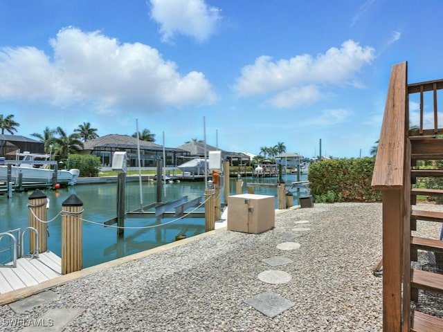 851 Perrine Ct, Marco Island, FL 34145 - surrounding community with a boat dock, boat lift, and a water view