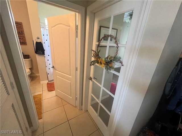 hallway with light tile patterned floors