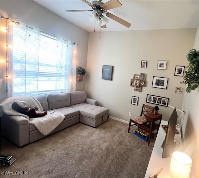 living room featuring carpet and ceiling fan