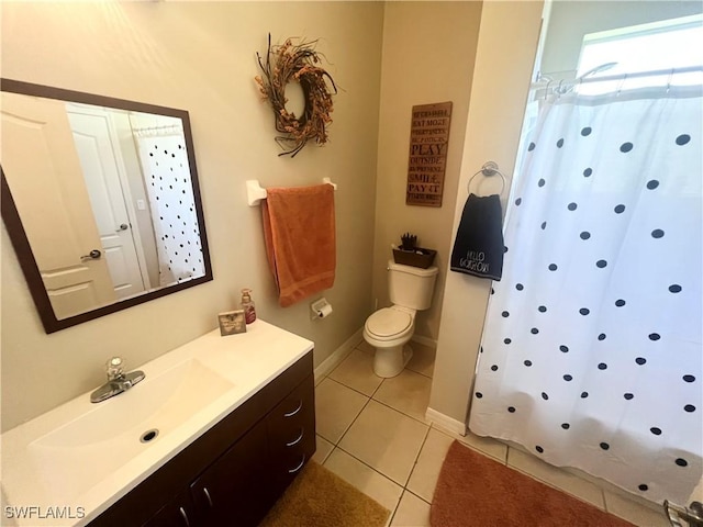 bathroom with tile patterned flooring, vanity, curtained shower, and toilet