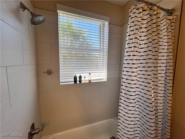 bathroom with shower / bath combination with curtain