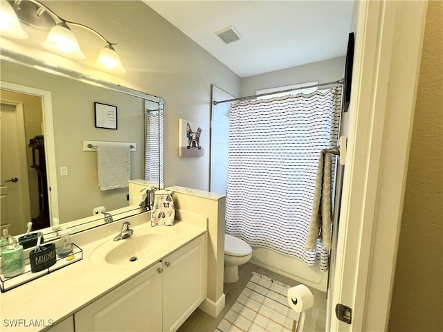 full bathroom featuring vanity, toilet, and shower / tub combo with curtain