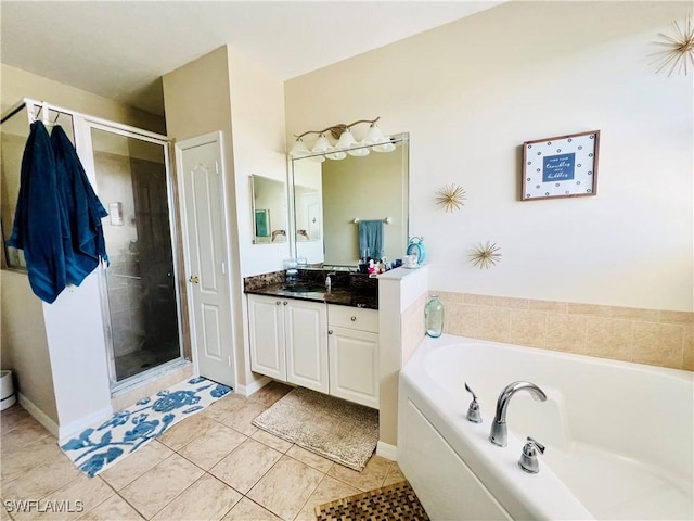 bathroom featuring tile patterned flooring, vanity, and shower with separate bathtub