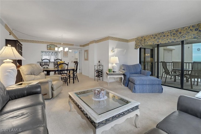 living room featuring light carpet and an inviting chandelier