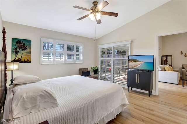 bedroom featuring light hardwood / wood-style flooring, vaulted ceiling, and ceiling fan