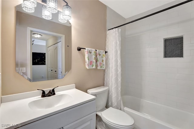 full bathroom with vanity, shower / bath combination with curtain, and toilet