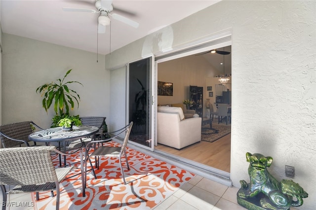 interior space with ceiling fan