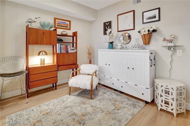 sitting room featuring light hardwood / wood-style flooring