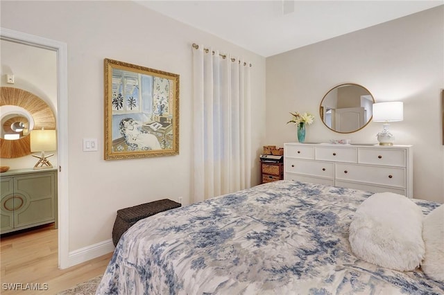 bedroom with light wood-type flooring