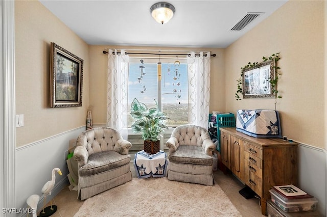 living area with light tile patterned floors