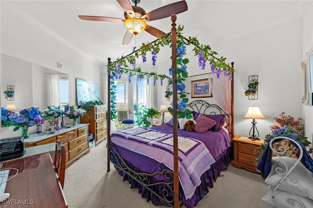 bedroom with ceiling fan, light colored carpet, and ornamental molding