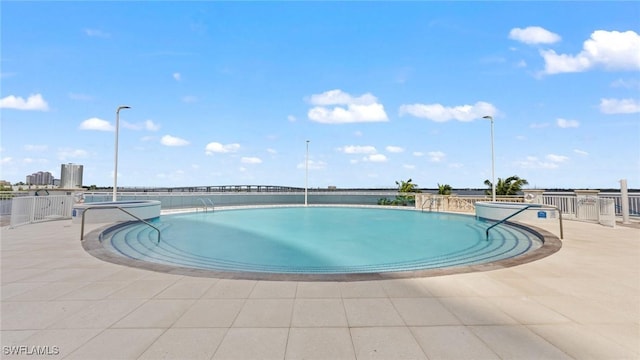 view of pool featuring a patio