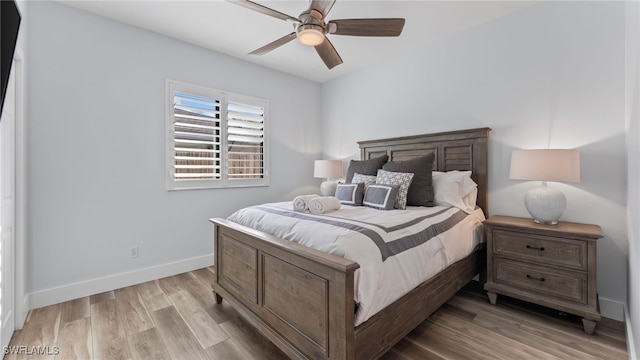 bedroom featuring ceiling fan and light hardwood / wood-style floors