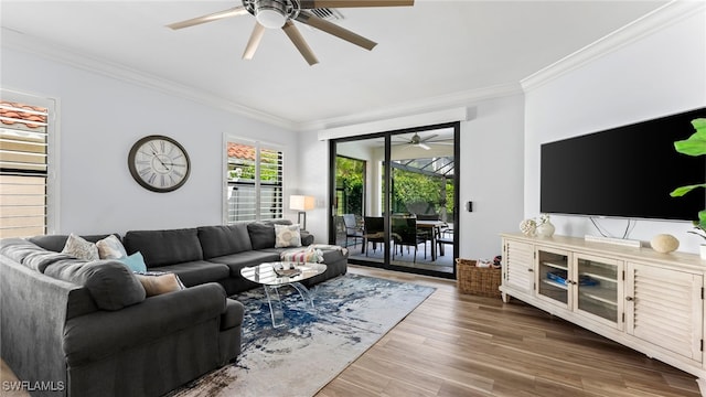 living room with hardwood / wood-style flooring and ornamental molding