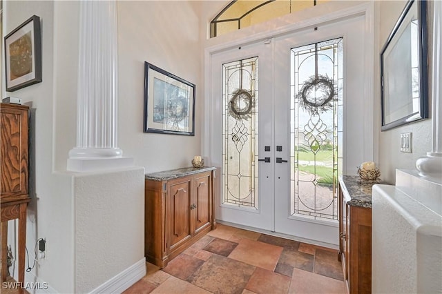 foyer entrance featuring french doors