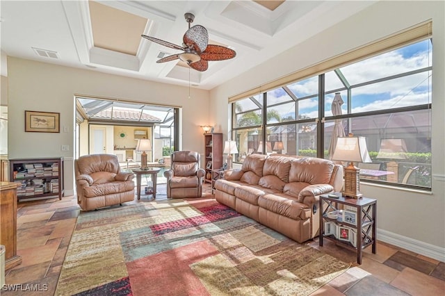 living room with beamed ceiling, ceiling fan, and coffered ceiling