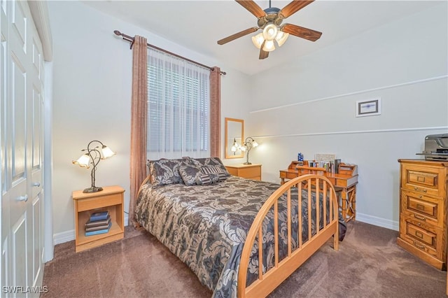 bedroom featuring ceiling fan, a closet, and dark carpet