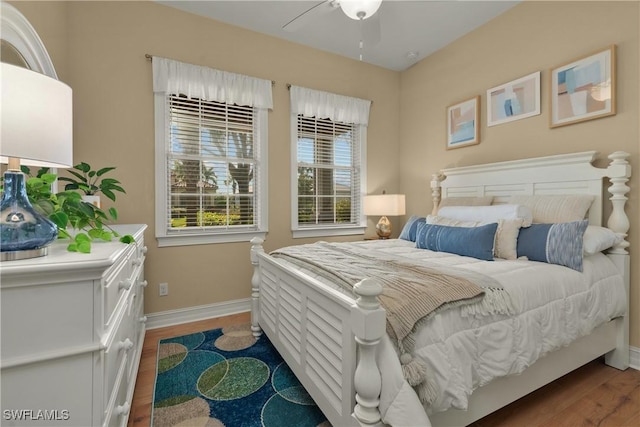 bedroom with hardwood / wood-style floors and ceiling fan