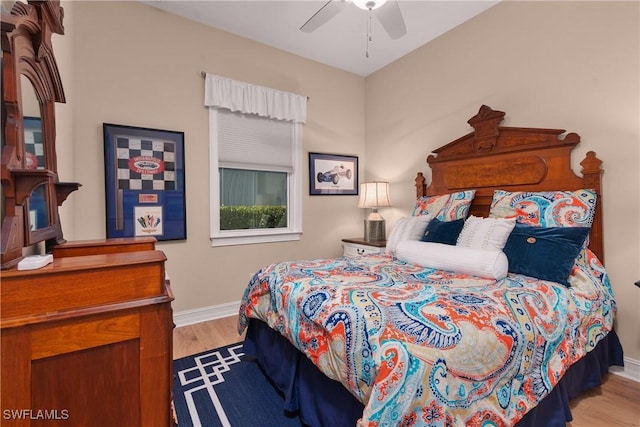 bedroom featuring ceiling fan and light hardwood / wood-style flooring